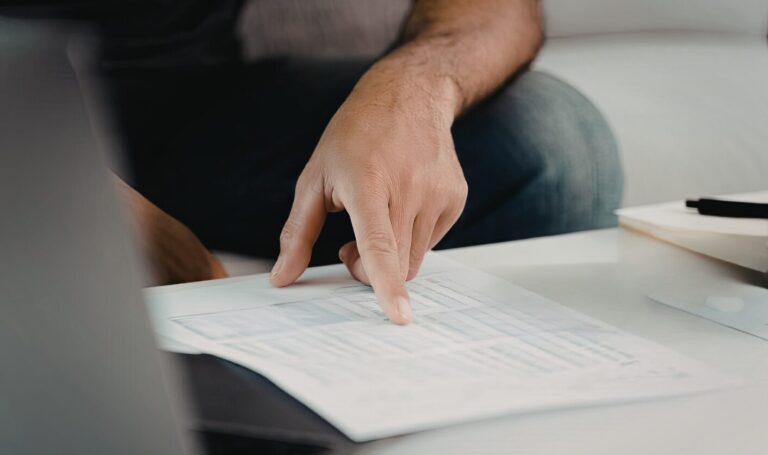 Landlord reviewing tenancy document and pointing at affordability details