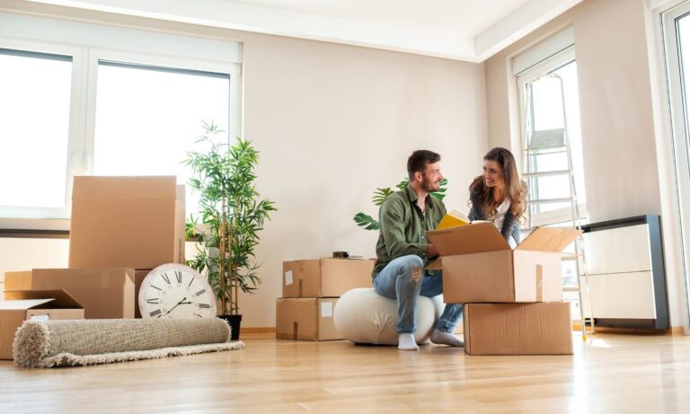 family unpacking boxes in new home Leicester school catchment area