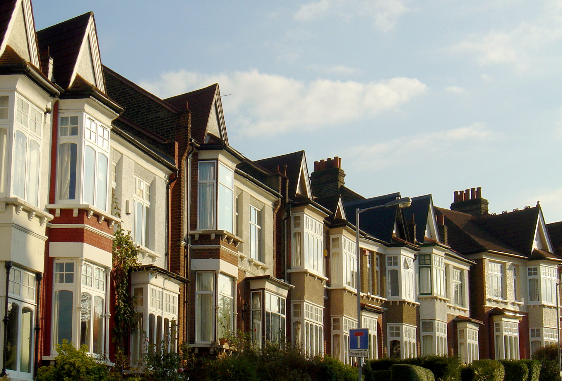 Row of traditional period houses in Wimborne with bay windows and classic suburban architecture