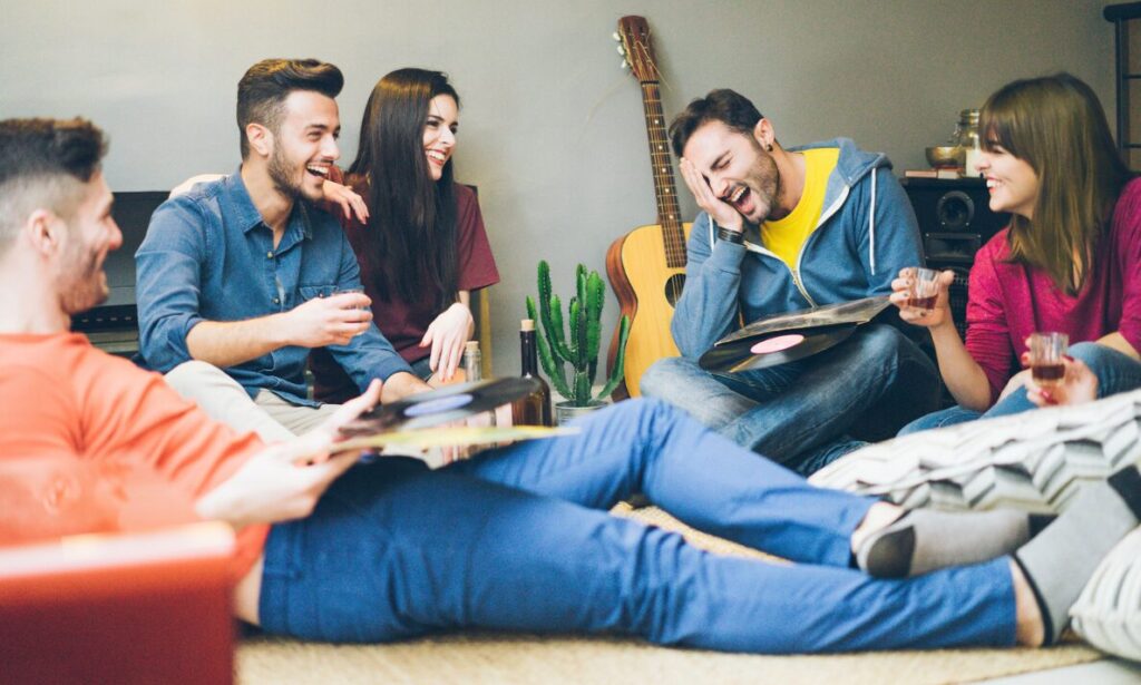 Students relaxing together in shared accommodation, representing Leicester student lets, HMO demand and landlord investment opportunities.