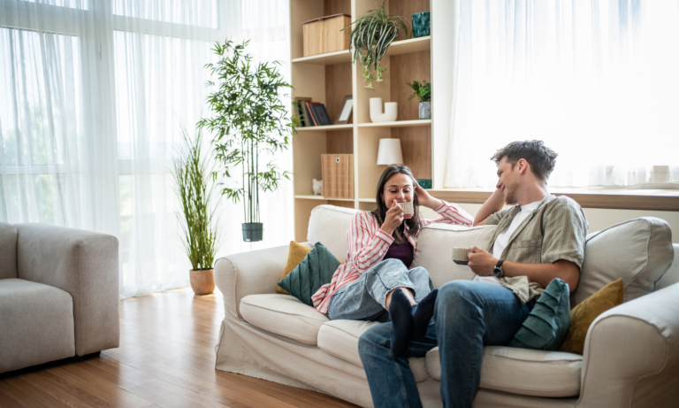 Young couple relaxing in their rented home in Wimborne