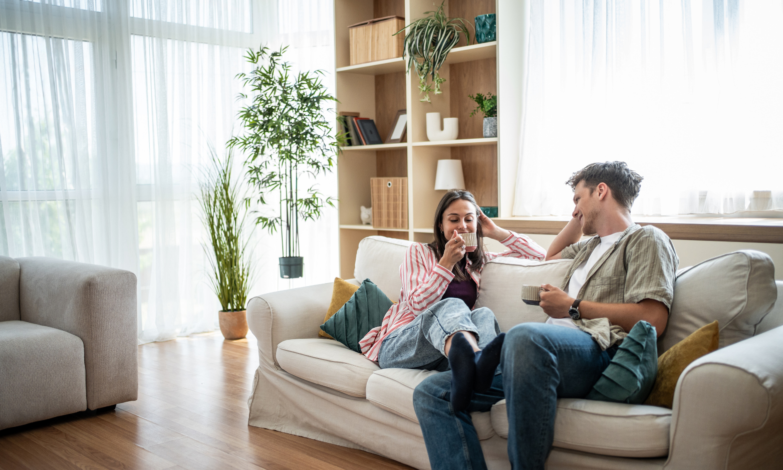 Young couple relaxing in their rented home in Wimborne