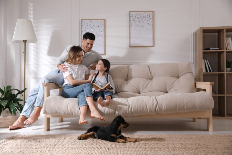 Family relaxing together in a bright living room, representing life for buyers and renters in Pamphill BH21.
